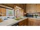 A cozy kitchen featuring a double sink and a laundry area at 4240 Friendship Rock Creek Rd, Burlington, NC 27215