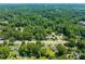 Wide aerial shot of a suburban neighborhood featuring houses and greenery at 430 Walnut St, Cary, NC 27511
