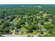 Expansive aerial view of a residential area with tree-lined streets and various houses at 430 Walnut St, Cary, NC 27511