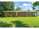 Spacious and well-maintained backyard with lush green grass and mature trees at 430 Walnut St, Cary, NC 27511