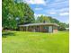 Expansive backyard with a lush lawn and mature trees, perfect for outdoor activities at 430 Walnut St, Cary, NC 27511