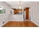 Cozy dining room featuring hardwood floors and a view into the kitchen at 430 Walnut St, Cary, NC 27511