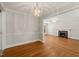 Elegant dining room with hardwood floors and a stylish chandelier with views to the living room at 430 Walnut St, Cary, NC 27511
