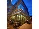 Corner brick building featuring an outdoor patio with cafe-style seating at 430 Walnut St, Cary, NC 27511