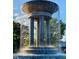 Large decorative fountain with water cascading down its multi-tiered structure at 430 Walnut St, Cary, NC 27511