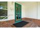 Charming front porch features a green door, brick steps, and classic white trim at 430 Walnut St, Cary, NC 27511
