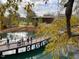 Scenic view of a pond, bridge, and modern building surrounded by trees at 430 Walnut St, Cary, NC 27511
