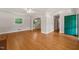 Spacious living room with hardwood floors, neutral walls, and a view into other rooms at 430 Walnut St, Cary, NC 27511