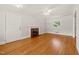 Inviting living room with hardwood floors, fireplace, neutral decor, and ample natural light at 430 Walnut St, Cary, NC 27511