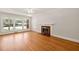 Bright living room with hardwood floors and a fireplace, perfect for entertaining guests at 430 Walnut St, Cary, NC 27511