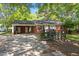 Charming brick home featuring a convenient carport and accessible ramp entrance at 4412 Green Spring Dr, Garner, NC 27529
