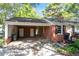 Brick home featuring an attached carport with access stairs to the front door entrance at 4412 Green Spring Dr, Garner, NC 27529