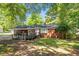 Charming single-story brick home featuring a covered front porch and a well-maintained lawn at 4412 Green Spring Dr, Garner, NC 27529