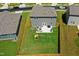A lush backyard features a patio, playset, and a well-maintained lawn, creating an outdoor haven at 444 Campbell Ridge Pl, Wendell, NC 27591