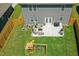 This backyard features a patio with cushioned seating, a barbecue grill, and a playset for outdoor fun at 444 Campbell Ridge Pl, Wendell, NC 27591