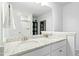 Elegant bathroom featuring double sinks with granite countertops and modern white cabinetry at 444 Campbell Ridge Pl, Wendell, NC 27591