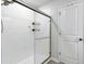 Modern bathroom showcasing a glass-enclosed shower with white subway tile and updated fixtures at 444 Campbell Ridge Pl, Wendell, NC 27591