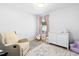 Charming Bedroom with a plush chair, dresser, soft rug, and decor, creating a cozy and inviting space at 444 Campbell Ridge Pl, Wendell, NC 27591