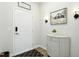 Bright entryway featuring a white front door, stylish decor, and a charming storage cabinet at 444 Campbell Ridge Pl, Wendell, NC 27591
