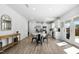 Open-concept kitchen with ample seating and a dining area featuring lots of light at 444 Campbell Ridge Pl, Wendell, NC 27591