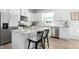 Kitchen with stainless steel appliances, white cabinets, and granite countertops is perfect for cooking and entertaining at 444 Campbell Ridge Pl, Wendell, NC 27591