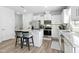 Contemporary kitchen with white cabinetry, stainless steel appliances, and a breakfast bar for casual dining at 444 Campbell Ridge Pl, Wendell, NC 27591