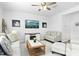 Bright living room with a ceiling fan, neutral paint colors, and ample seating for guests at 444 Campbell Ridge Pl, Wendell, NC 27591