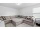 Living room featuring a large sectional couch and neutral colored carpet at 444 Campbell Ridge Pl, Wendell, NC 27591