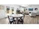 Open concept living room provides access to the kitchen and ample windows for lots of light at 444 Campbell Ridge Pl, Wendell, NC 27591