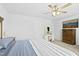 Bright main bedroom features a ceiling fan, natural light, hard wood floors, and comfortable furnishings at 444 Campbell Ridge Pl, Wendell, NC 27591