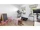 Bright playroom with hardwood floors, natural light, and an assortment of toys and play equipment at 444 Campbell Ridge Pl, Wendell, NC 27591