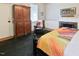Bedroom features a fireplace and a comfortable bed with a quilt at 4822 Nc Highway 98 W, Youngsville, NC 27596