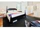 Spacious bedroom features a bed, windows, and cozy accents at 4822 Nc Highway 98 W, Youngsville, NC 27596