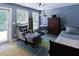 Cozy bedroom featuring ample natural light, hardwood floors, and neutral tones at 4822 Nc Highway 98 W, Youngsville, NC 27596