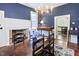 Charming dining room with a decorative fireplace, chandelier and hardwood floors at 4822 Nc Highway 98 W, Youngsville, NC 27596
