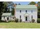 Charming two-story home with light green roof and an outbuilding perfect for workshop or storage at 4822 Nc Highway 98 W, Youngsville, NC 27596