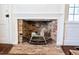 Decorative fireplace with brick surround and mantel, adding character to the home at 4822 Nc Highway 98 W, Youngsville, NC 27596