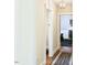 Bright hallway with hardwood floors leads to a living area with fireplace at 4822 Nc Highway 98 W, Youngsville, NC 27596