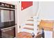 Kitchen with stainless steel oven and wooden stairs for easy access to the next floor at 4822 Nc Highway 98 W, Youngsville, NC 27596