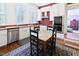 Eat-in kitchen featuring stainless steel appliances, white cabinets, and a butcher block countertop at 4822 Nc Highway 98 W, Youngsville, NC 27596