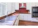 Modern kitchen features stainless steel appliances, wood counters, and bright, natural light at 4822 Nc Highway 98 W, Youngsville, NC 27596