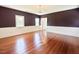 Spacious living room boasts rich wood floors and ample natural light at 4822 Nc Highway 98 W, Youngsville, NC 27596