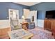 Inviting living room featuring neutral chairs, a vintage rug, and wood floors at 4822 Nc Highway 98 W, Youngsville, NC 27596