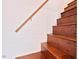 Wood stairs with handrail showcasing the home's classic design at 4822 Nc Highway 98 W, Youngsville, NC 27596
