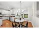 Bright dining area near the kitchen with a modern chandelier and lots of natural light at 501 Ivyshaw Rd, Cary, NC 27519