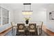 Elegant dining room with modern chandelier and window views at 501 Ivyshaw Rd, Cary, NC 27519