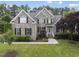 Charming two-story brick home with black shutters and lush landscaping at 501 Ivyshaw Rd, Cary, NC 27519
