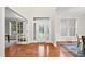 Bright foyer with hardwood floors and decorative glass front door, offering a welcoming entrance to the home at 501 Ivyshaw Rd, Cary, NC 27519