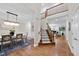 Elegant foyer with hardwood floors, staircase, and open view to living spaces at 501 Ivyshaw Rd, Cary, NC 27519