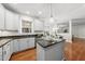 A bright kitchen featuring granite countertops, stainless appliances, and an adjacent dining area at 501 Ivyshaw Rd, Cary, NC 27519
